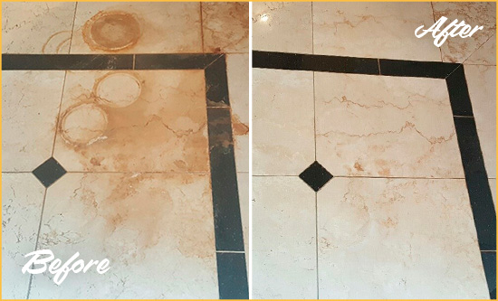Before and After Picture of a Doylestown Hard Surface Restoration Service on a Marble Floor to Eliminate Rust Stains